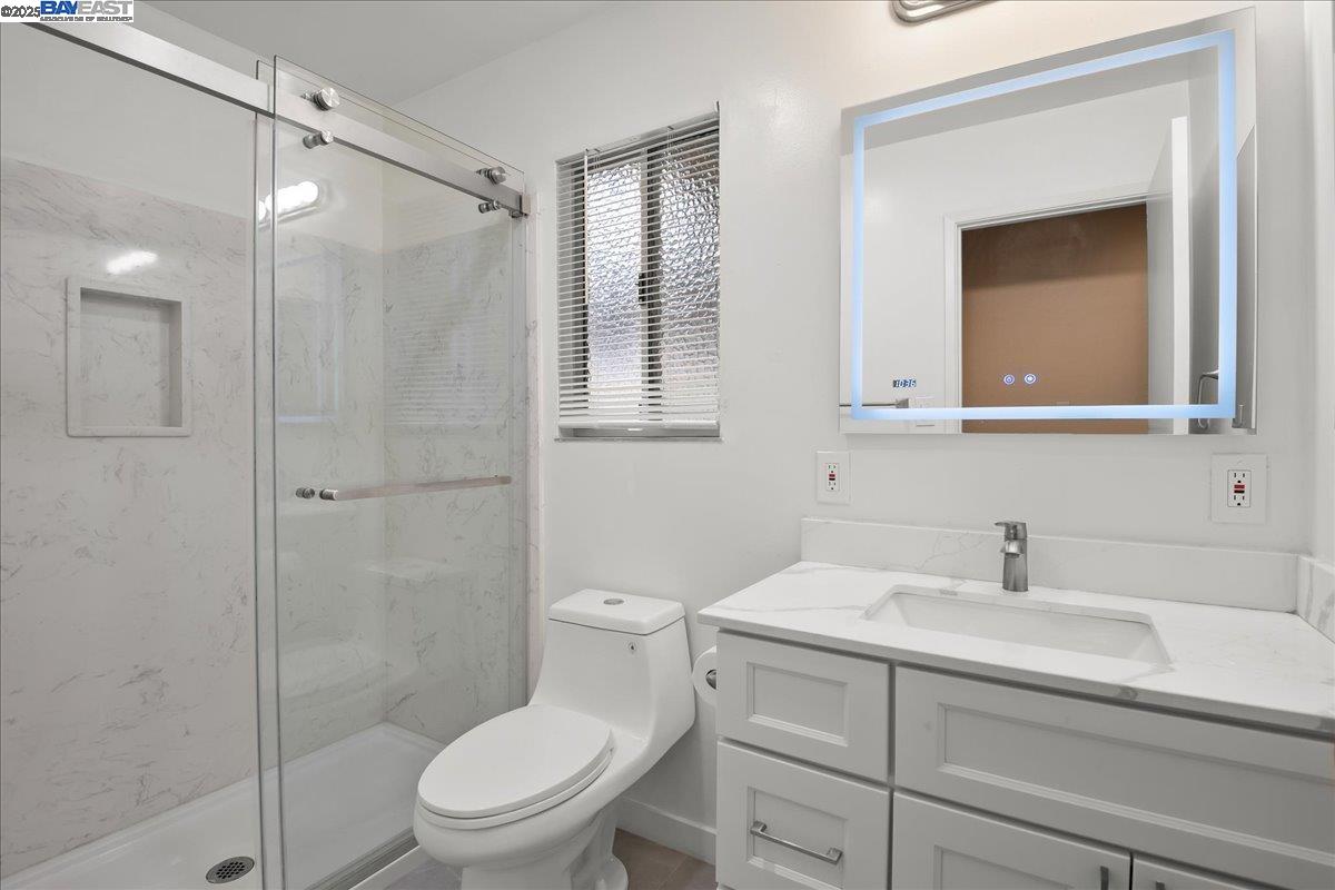 1043 Bonner Avenue Fremont, CA 94536 - Photo 9 of 16 a bathroom with a sink a toilet and shower