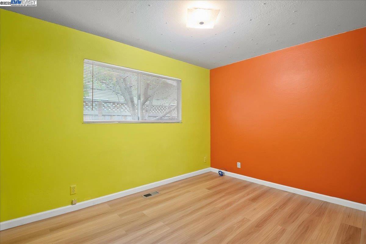 1043 Bonner Avenue Fremont, CA 94536 - Photo 10 of 16 a view of a big room with wooden floor