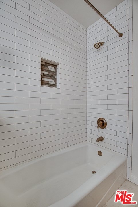 8204 Pershing Drive Playa del Rey, CA 90293 - Photo 18 of 20 a bathroom with a bathtub and shower