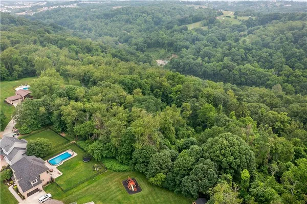 a view of a street with a yard