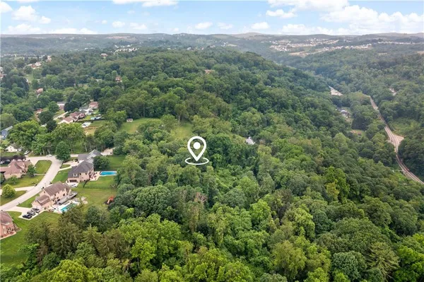a view of a lake with top of house
