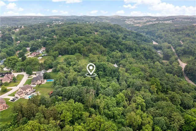 a view of a lake with top of house