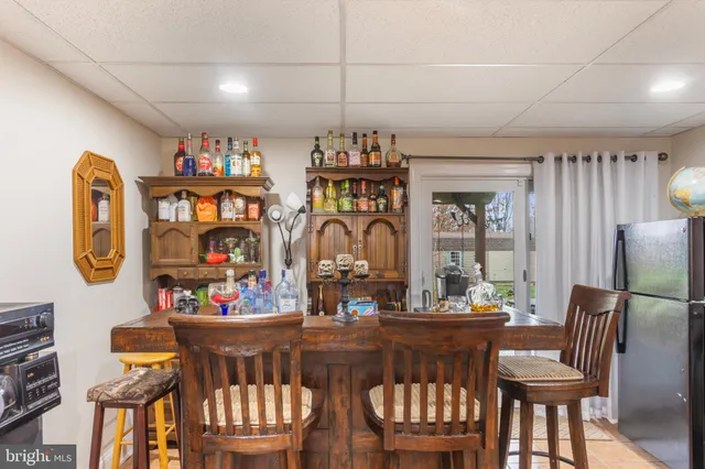 a view of a dining room with furniture window and outdoor kitchen