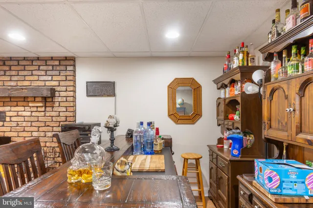 a living room filled with furniture and a book shelf