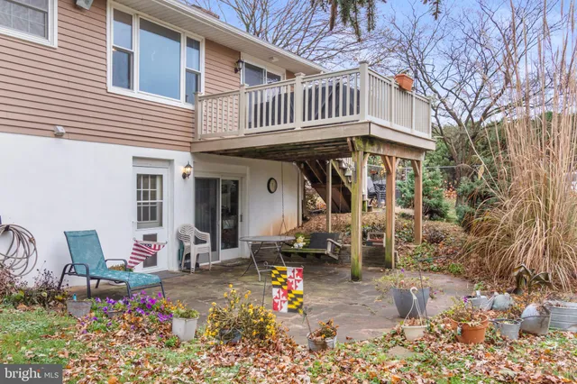 a front view of a house with outdoor seating