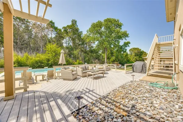 a view of roof deck with patio