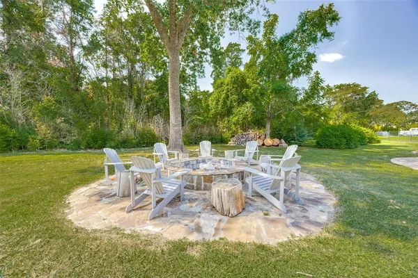 a view of a chair and table on the garden