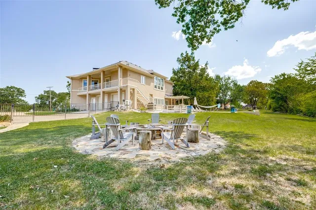 a view of a house with a yard porch and sitting area