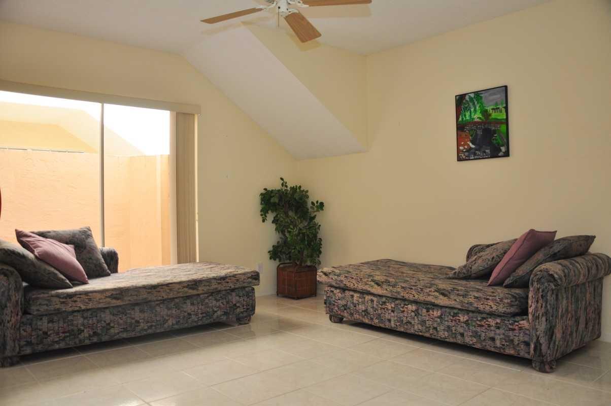 17288 Boca Club Boulevard, Unit 2001 Boca Raton, FL 33487 - Photo 15 of 25 a living room with furniture and a couch