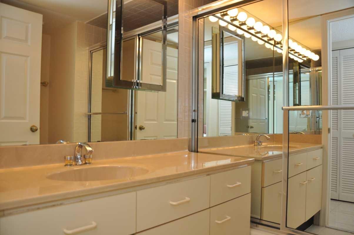 17288 Boca Club Boulevard, Unit 2001 Boca Raton, FL 33487 - Photo 17 of 25 a bathroom with a sink and a mirror
