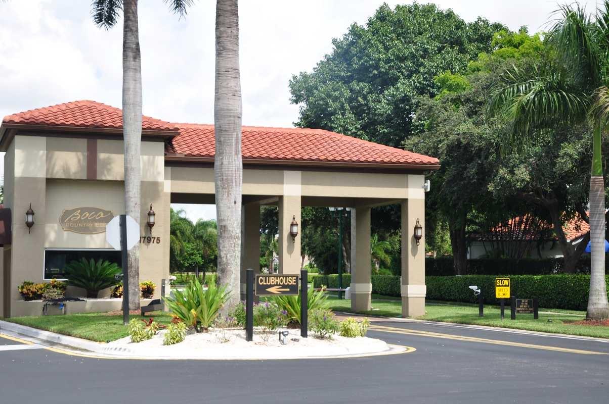 17288 Boca Club Boulevard, Unit 2001 Boca Raton, FL 33487 - Photo 20 of 25 a front view of a building with garden
