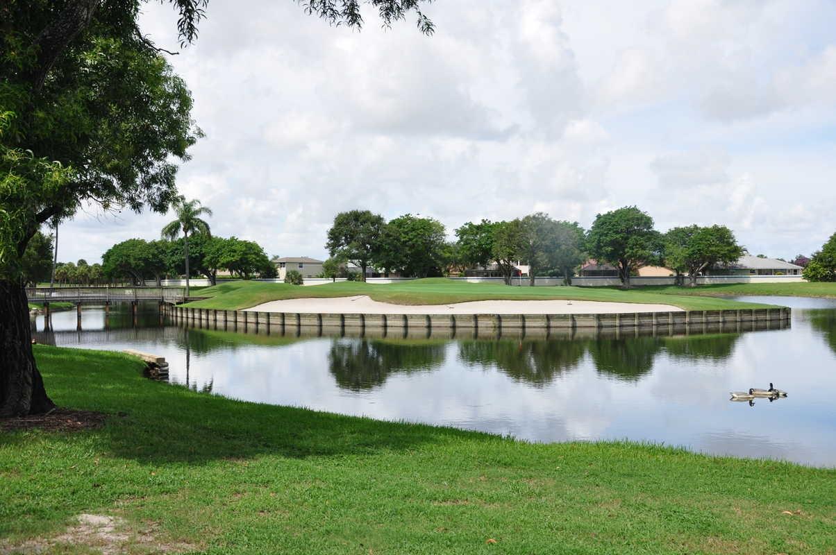 17288 Boca Club Boulevard, Unit 2001 Boca Raton, FL 33487 - Photo 2 of 25 a view of a lake with a city from a lake