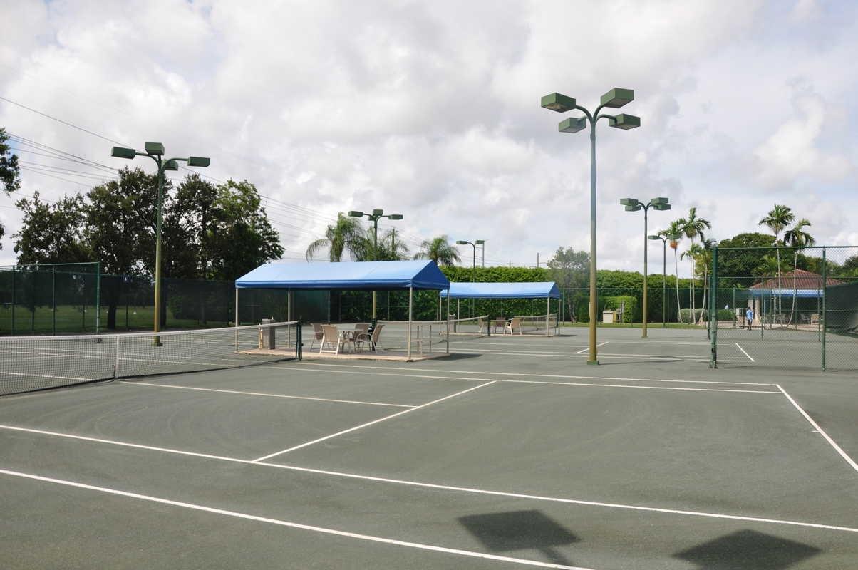 17288 Boca Club Boulevard, Unit 2001 Boca Raton, FL 33487 - Photo 25 of 25 a view of a tennis ground with large trees