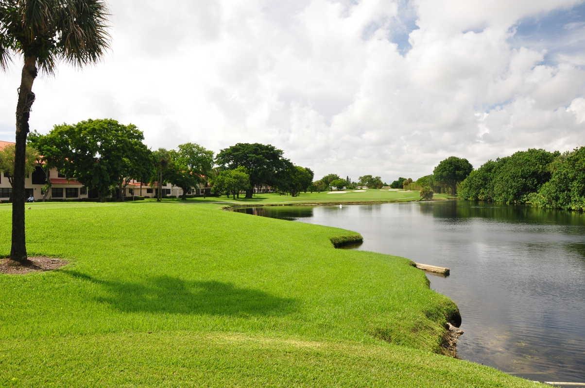 17288 Boca Club Boulevard, Unit 2001 Boca Raton, FL 33487 - Photo 3 of 25 a view of a lake with a big yard
