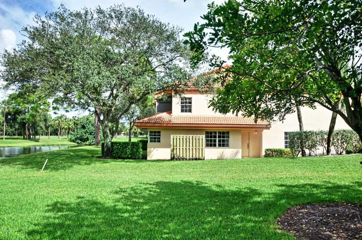 17288 Boca Club Boulevard, Unit 2001 Boca Raton, FL 33487 - Photo 4 of 25 a house that is sitting in the grass
