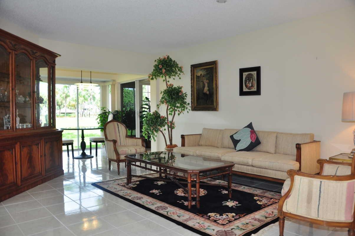 17288 Boca Club Boulevard, Unit 2001 Boca Raton, FL 33487 - Photo 6 of 25 a living room with furniture and a fireplace