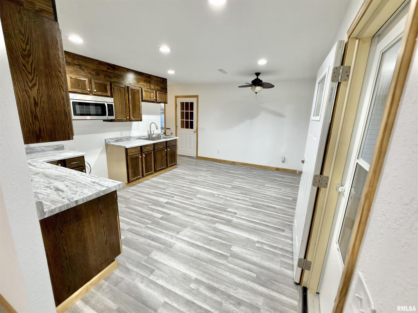 274 Oaktree Avenue Salem, IL 62881 - Photo 12 of 44 a kitchen with stainless steel appliances granite countertop wooden cabinets a sink and dishwasher a stove top oven