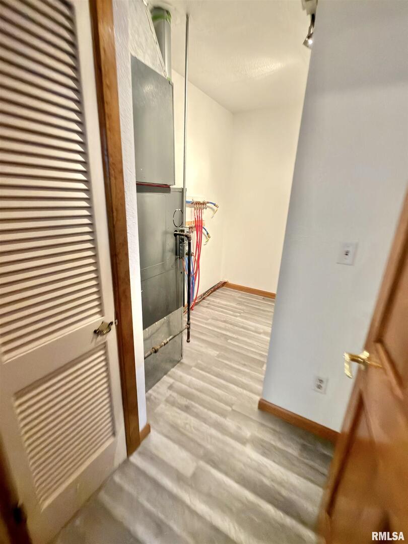 274 Oaktree Avenue Salem, IL 62881 - Photo 17 of 45 a view of a hallway view with wooden floor and staircase