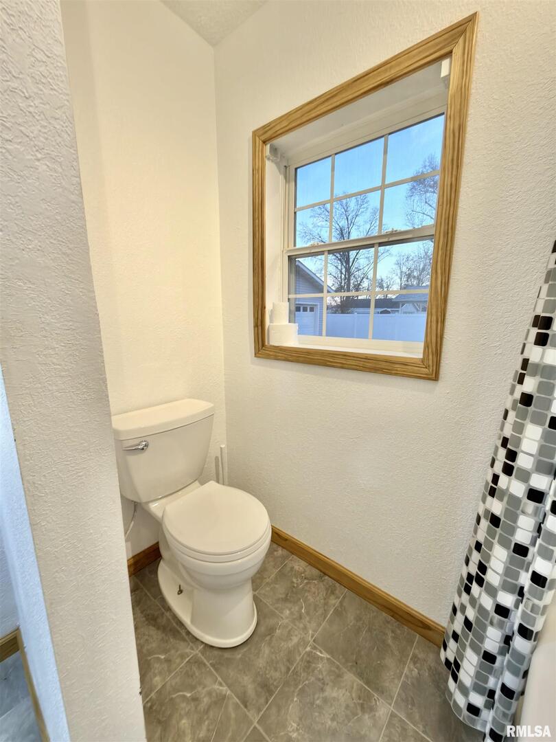 274 Oaktree Avenue Salem, IL 62881 - Photo 20 of 45 a white toilet sitting next to a window