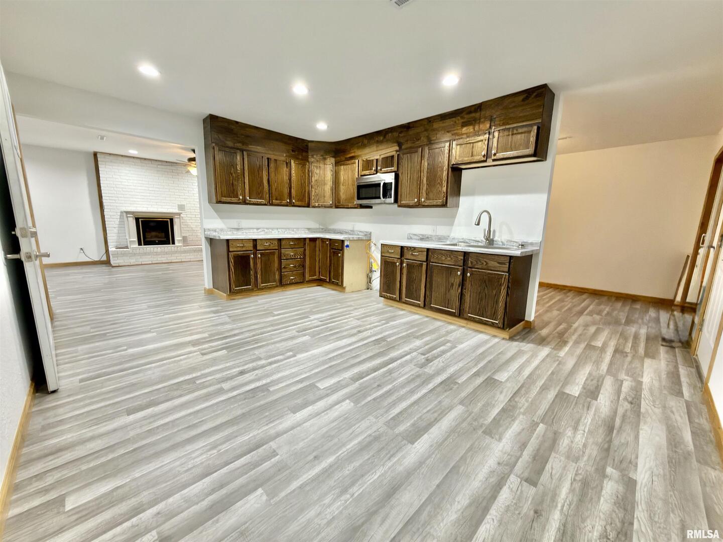 274 Oaktree Avenue Salem, IL 62881 - Photo 2 of 44 a large kitchen with stainless steel appliances wooden floor and wooden cabinets