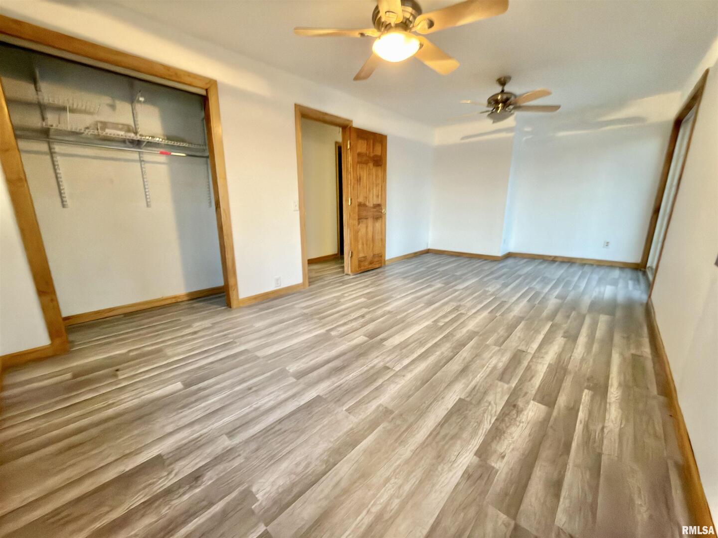 274 Oaktree Avenue Salem, IL 62881 - Photo 22 of 44 wooden floor in an empty room with a mirror