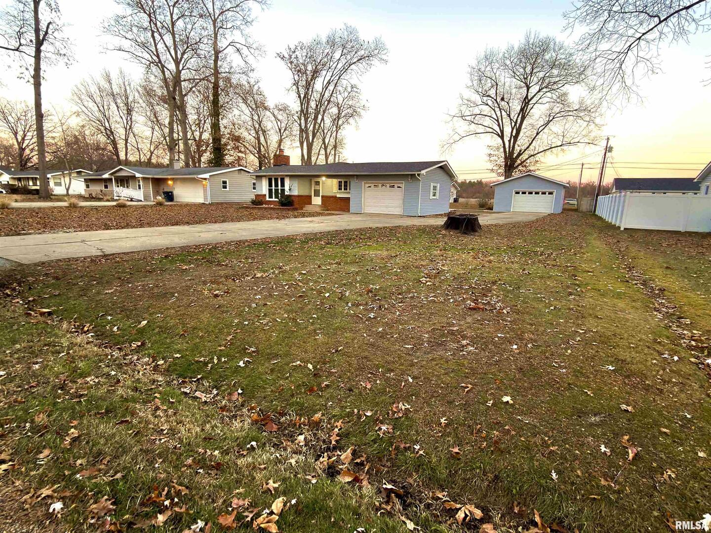 274 Oaktree Avenue Salem, IL 62881 - Photo 44 of 44 a view of a yard with a house and trees in the background