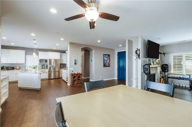 a view of a dining room with furniture and wooden floor
