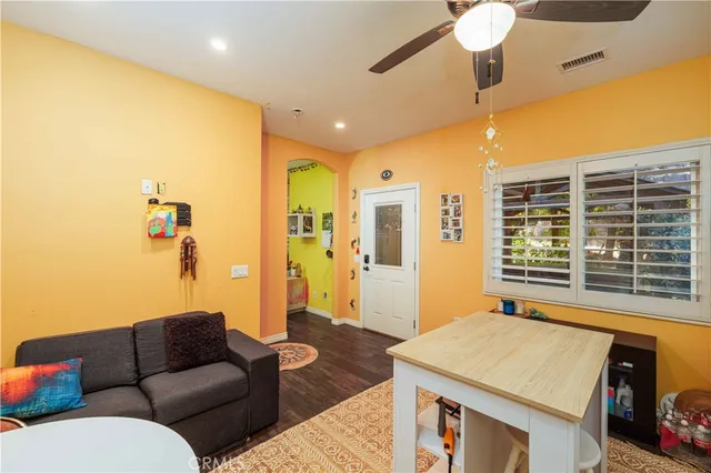 an aerial view of residential houses with outdoor space and trees