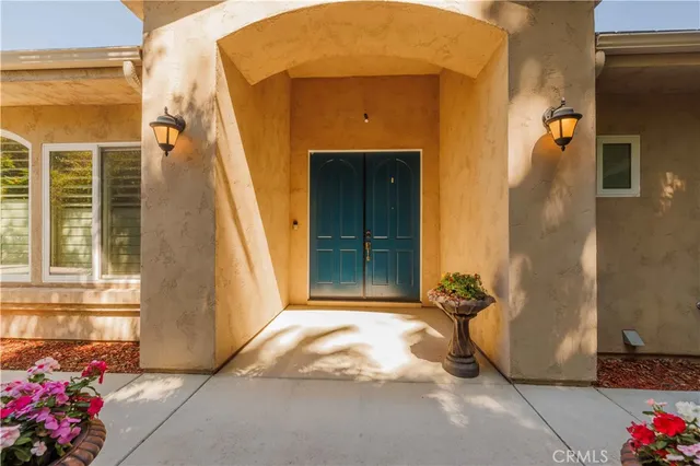 a large kitchen with stainless steel appliances kitchen island a stove a sink a refrigerator and cabinets