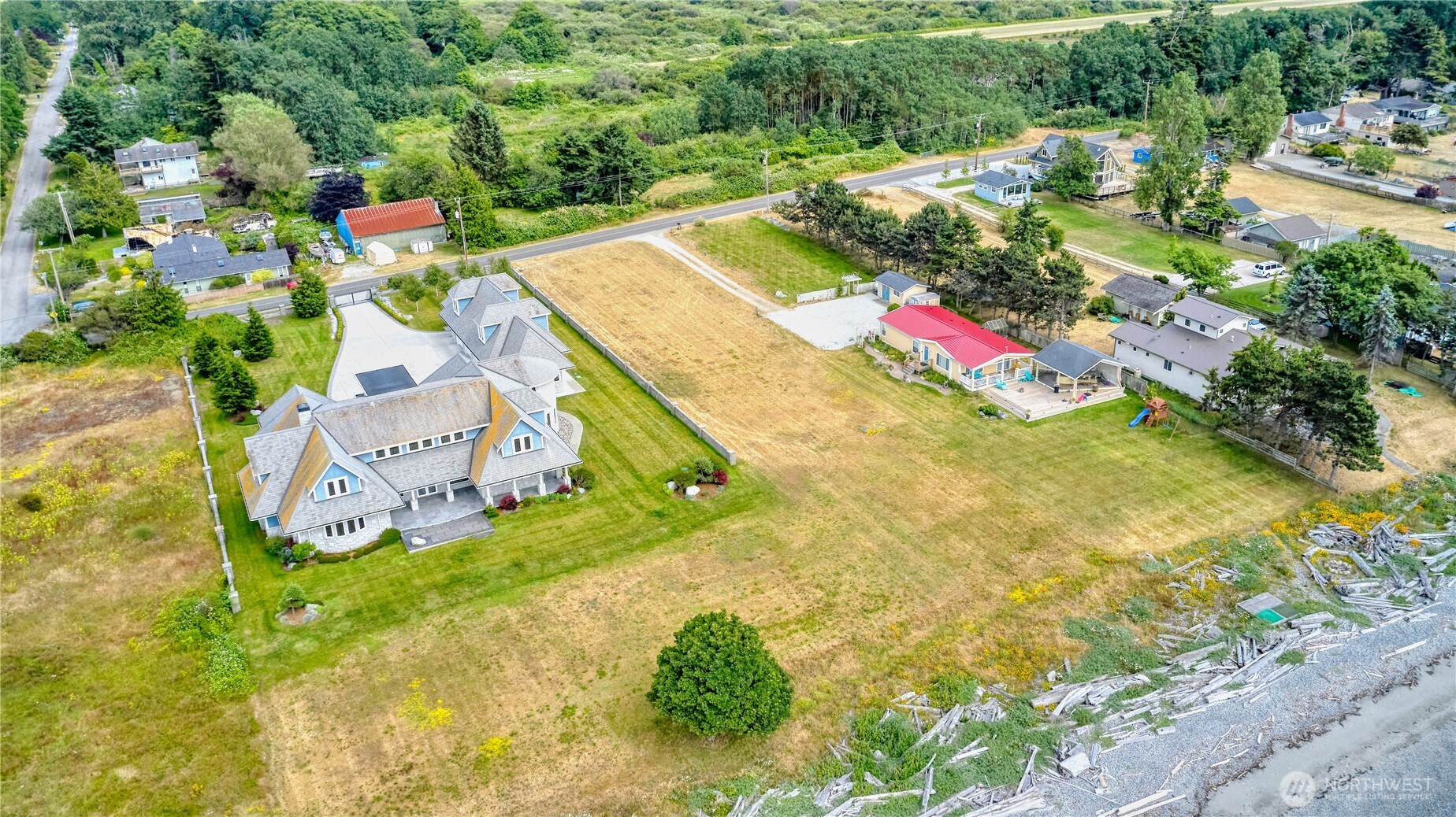 585 Marine Drive Point Roberts, WA 98281 - Photo 13 of 21 an aerial view of residential house with swimming pool and lawn chairs