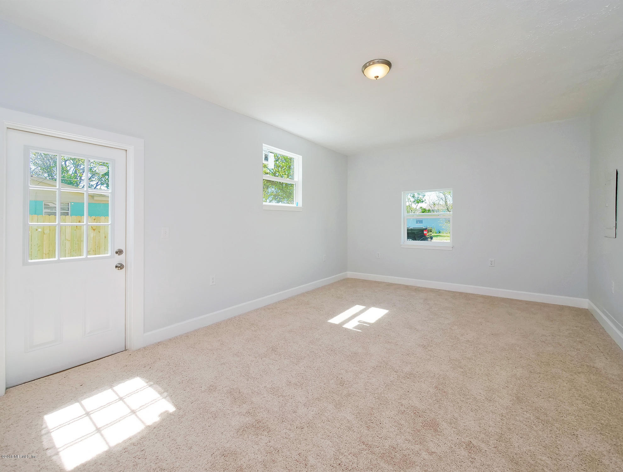 411 Skate Road Atlantic Beach, FL 32233 - Photo 13 of 26 a view of an empty room with a window