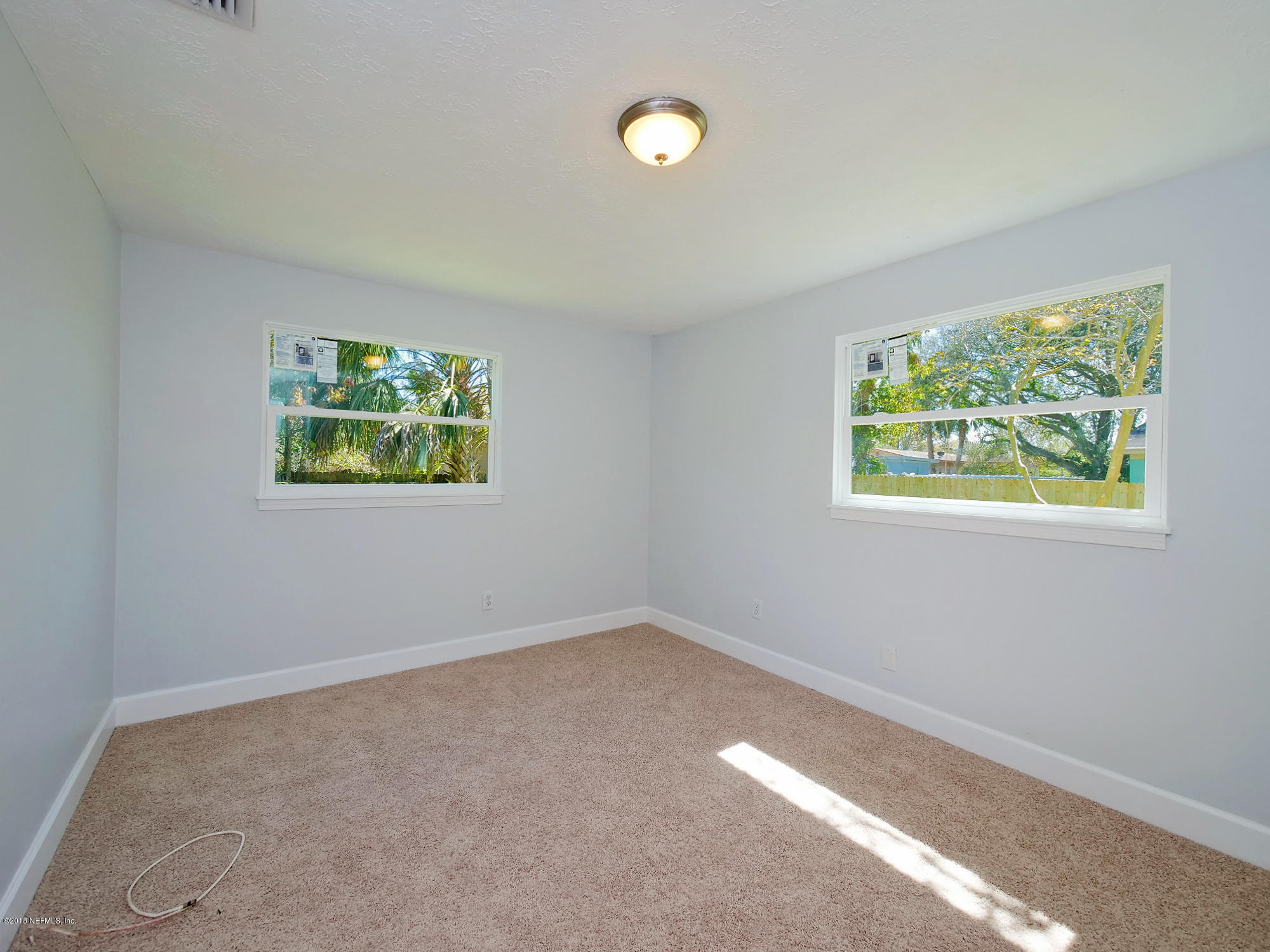 411 Skate Road Atlantic Beach, FL 32233 - Photo 14 of 26 an empty room with windows