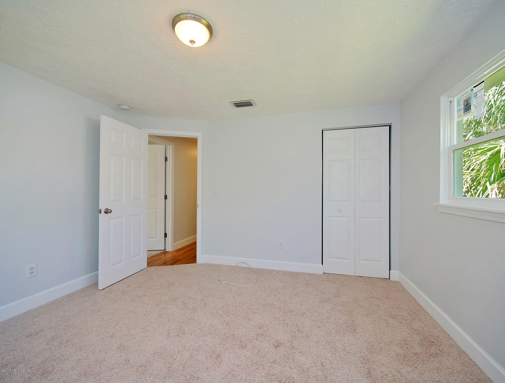411 Skate Road Atlantic Beach, FL 32233 - Photo 19 of 26 a view of an empty room with a window