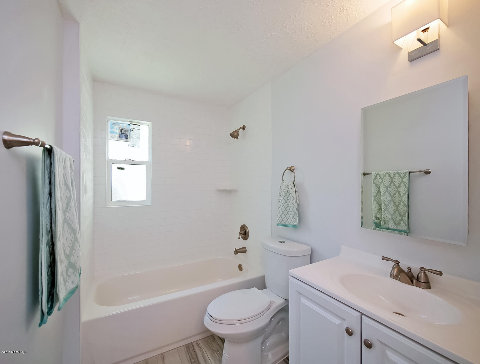 411 Skate Road Atlantic Beach, FL 32233 - Photo 20 of 26 a bathroom with a sink toilet and shower