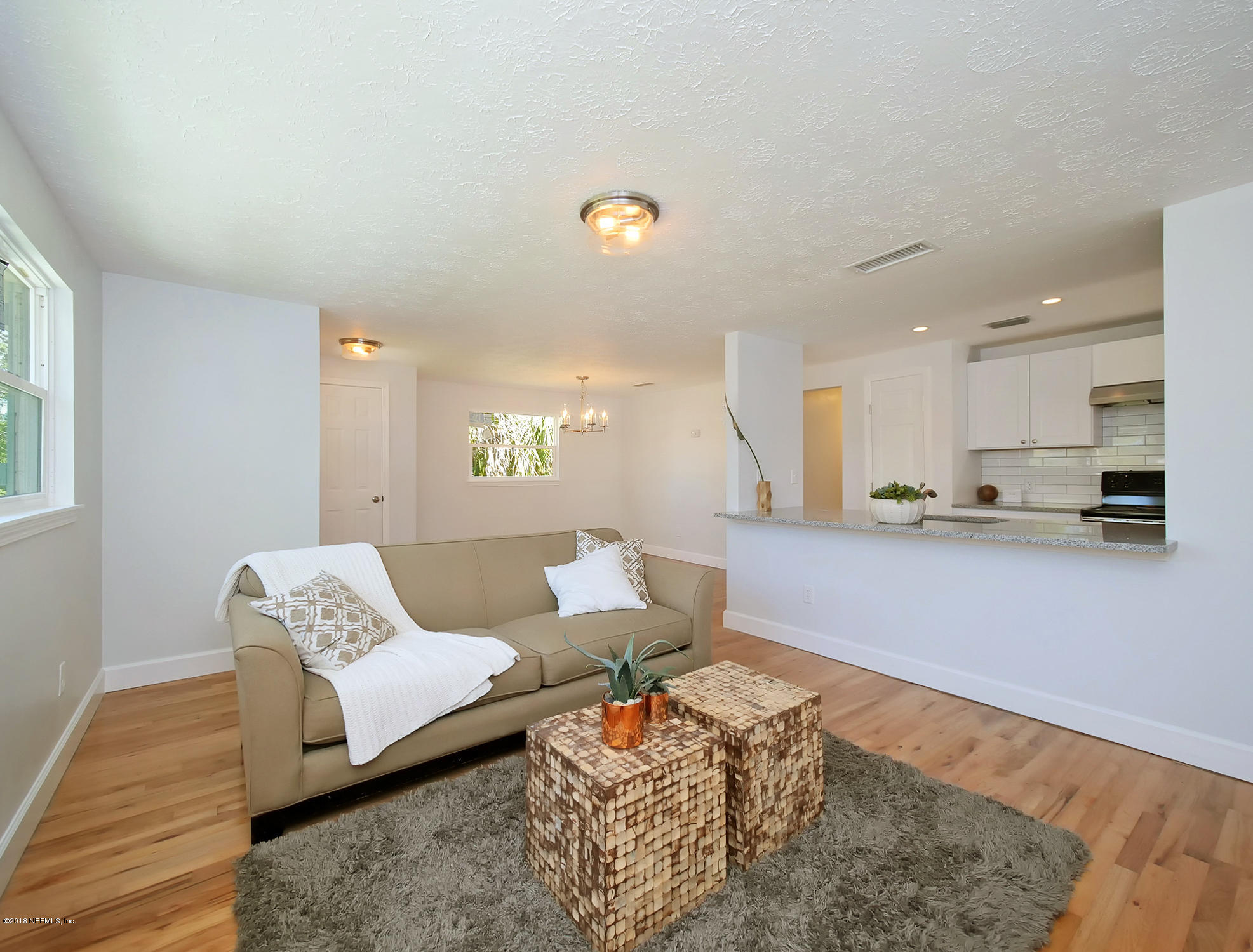 411 Skate Road Atlantic Beach, FL 32233 - Photo 6 of 26 a living room with furniture and a couch
