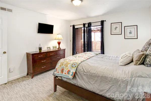 a bedroom with a bed and cabinets
