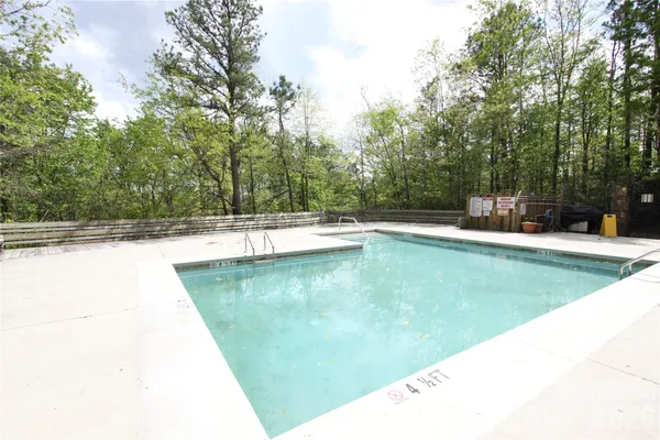 a view of a backyard with table and chairs