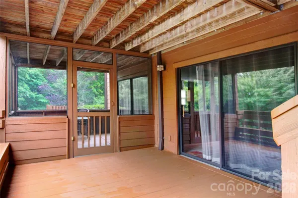 a kitchen with stainless steel appliances granite countertop a stove a refrigerator a kitchen island a table and chairs