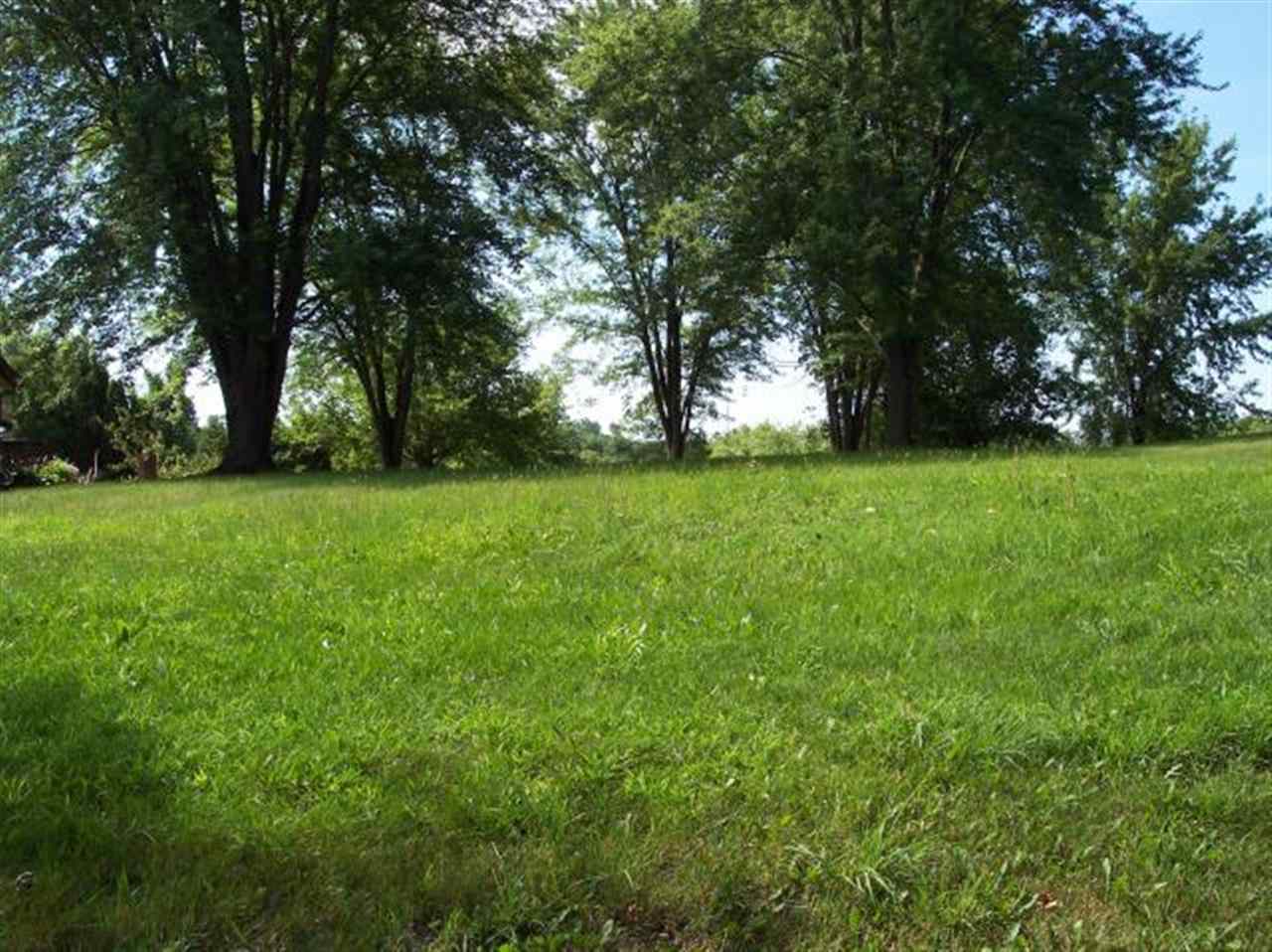 2070 Hillsdown Road Lake Summerset, IL 61019 - Photo 1 of 12 a view of a green field with trees in the background
