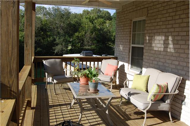 2394 Pleasant View Road Pleasant View, TN 37146 - Photo 15 of 19 Covered deck with 2 ceiling fans. Overlooks private backyard into the woods.