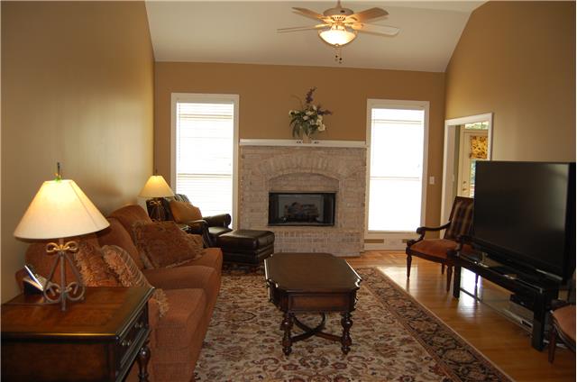 2394 Pleasant View Road Pleasant View, TN 37146 - Photo 4 of 19 Great room with soaring ceiling and gas log fireplace. Hardwood floors with design