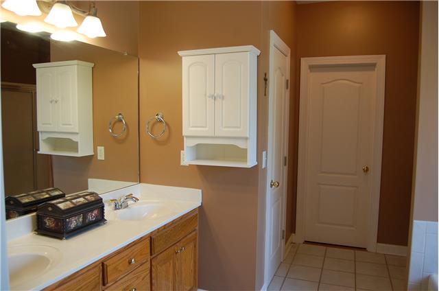 2394 Pleasant View Road Pleasant View, TN 37146 - Photo 10 of 19 Master bathroom has double vanities, separate toilet room, and full sized shower, walk in closet