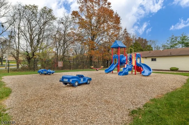 a childrens park with lots of swings and slides