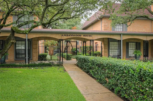 front view of a building with a garden