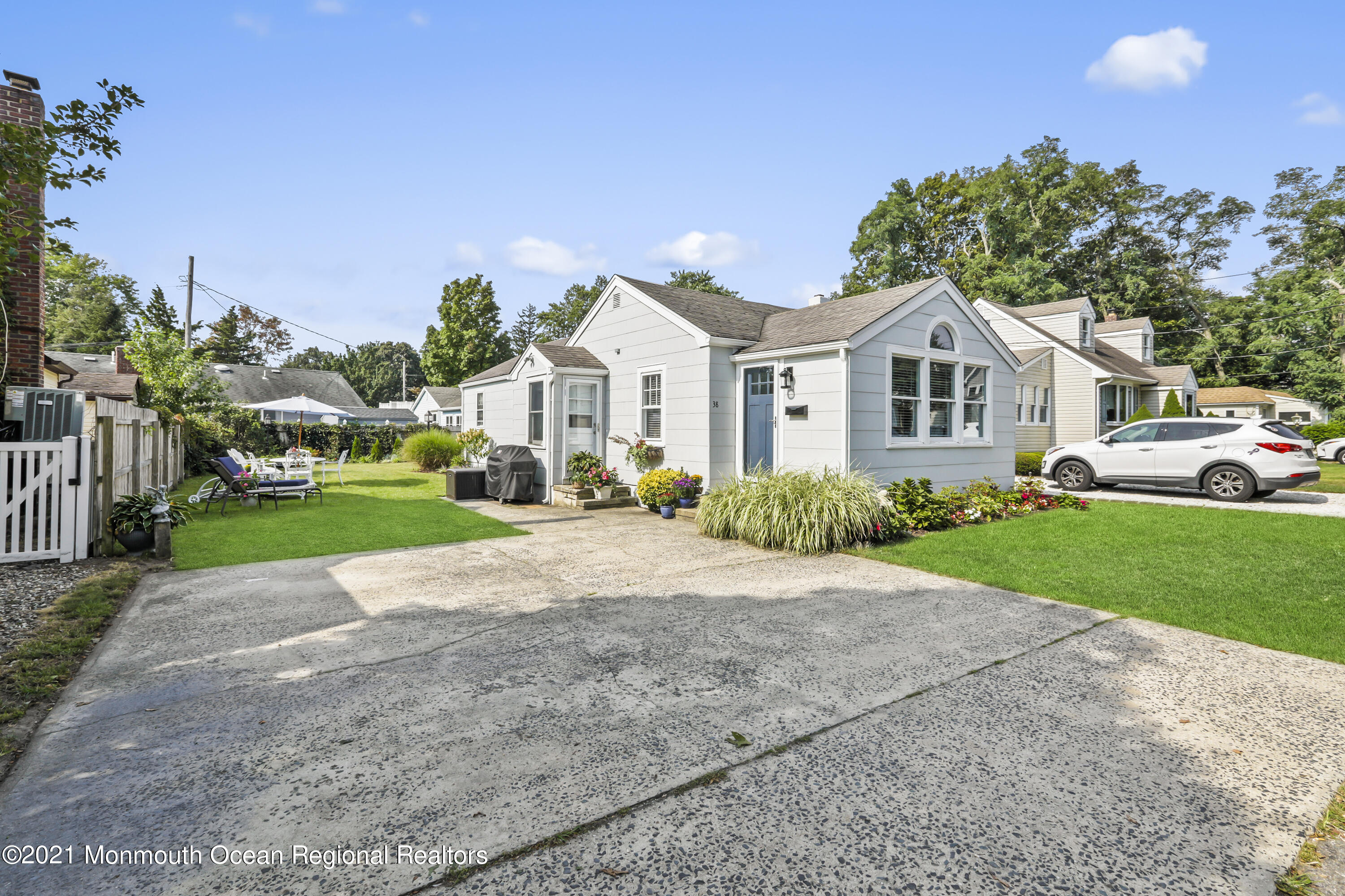 38 Hulse Landing Road Brick, NJ 08723 - Photo 4 of 38 a front view of a house with a garden and plants