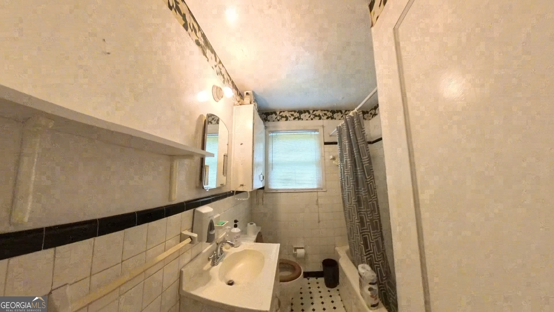 536 Allendale Drive Decatur, GA 30032 - Photo 2 of 10 a bathroom with a sink and a mirror