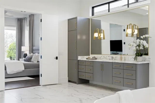 a spacious bathroom with a tub sink shower and mirror