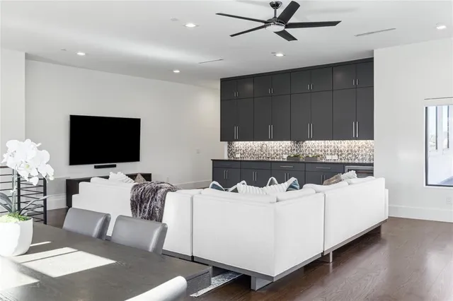 a view of a a dining room with furniture window and wooden floor