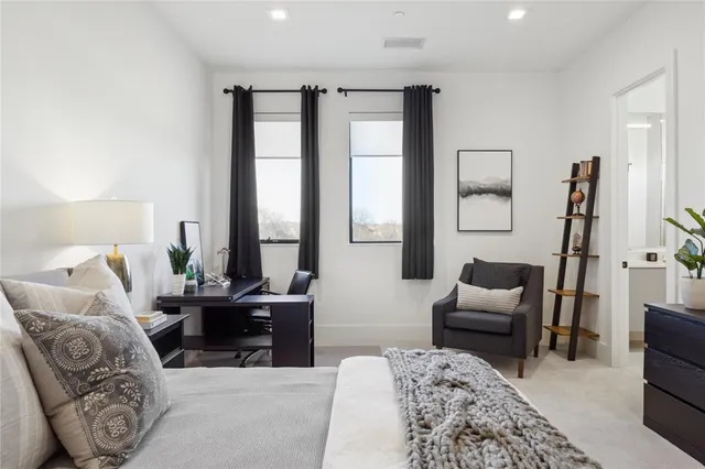 a very nice looking living room with a large window and chandelier
