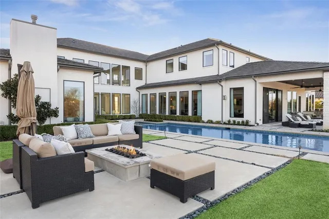 an aerial view of a house with a big yard